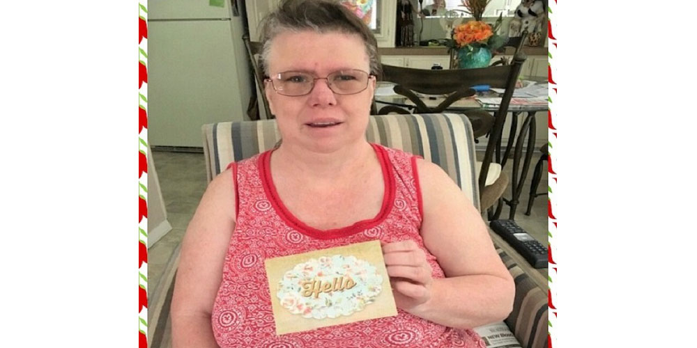 Here's Lisa showing off a card she received from her job coach Alicia