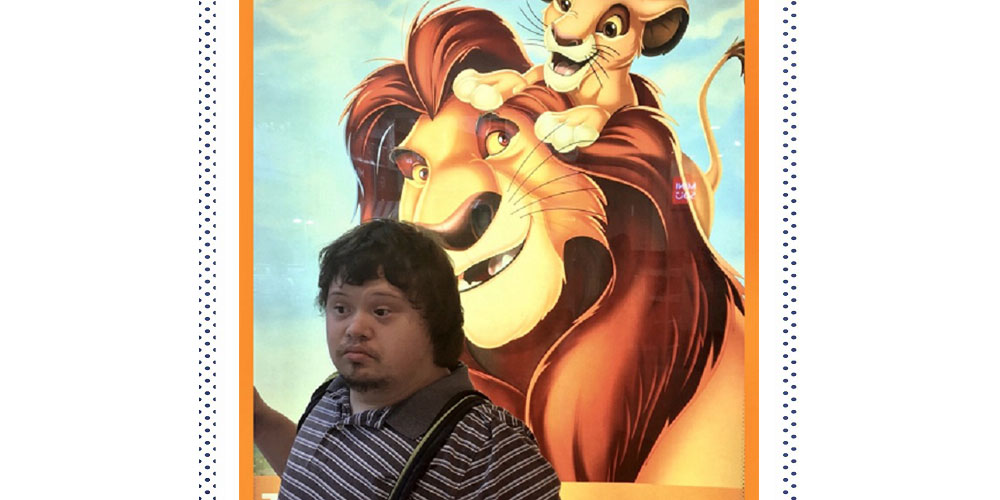 Here's Tyler using a Lion King advertisement as a great photo opportunity on one of his walks