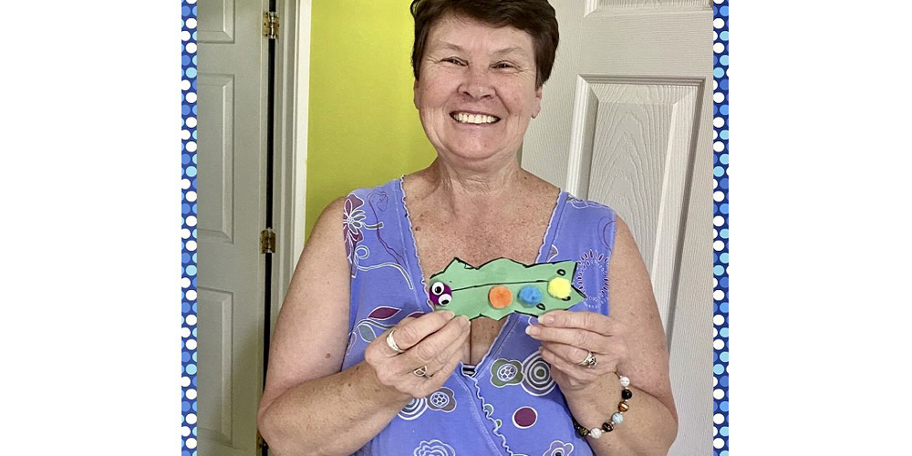 Here's Debbie with her finished art project from ADP's first Zoom arts and crafts class