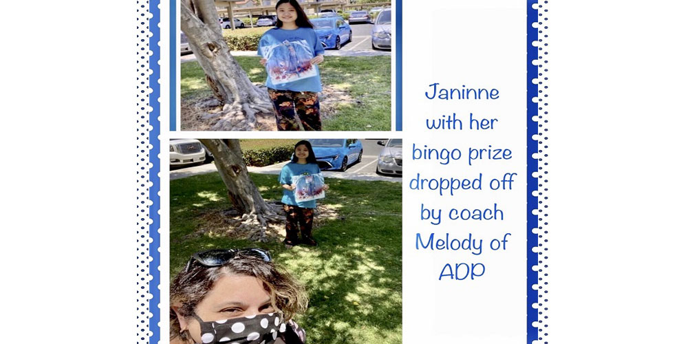 Here's ADP bingo prize winner Janinne receiving her prize from job coach Melody